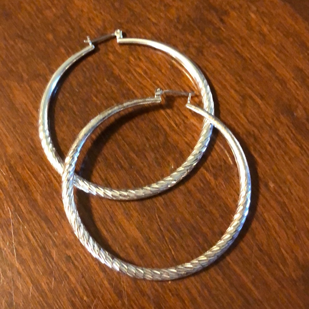 Silver earrings.